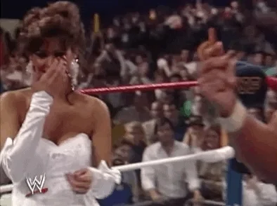 Hulk Hogan making a money gesture and pointing at Macho Man - GIF image